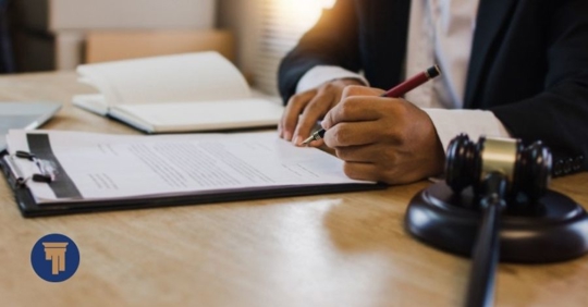 lawyer writing on a document